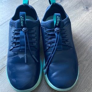 Clove shoes. Dark blue with aqua blue soles and trim. Spill resistant.